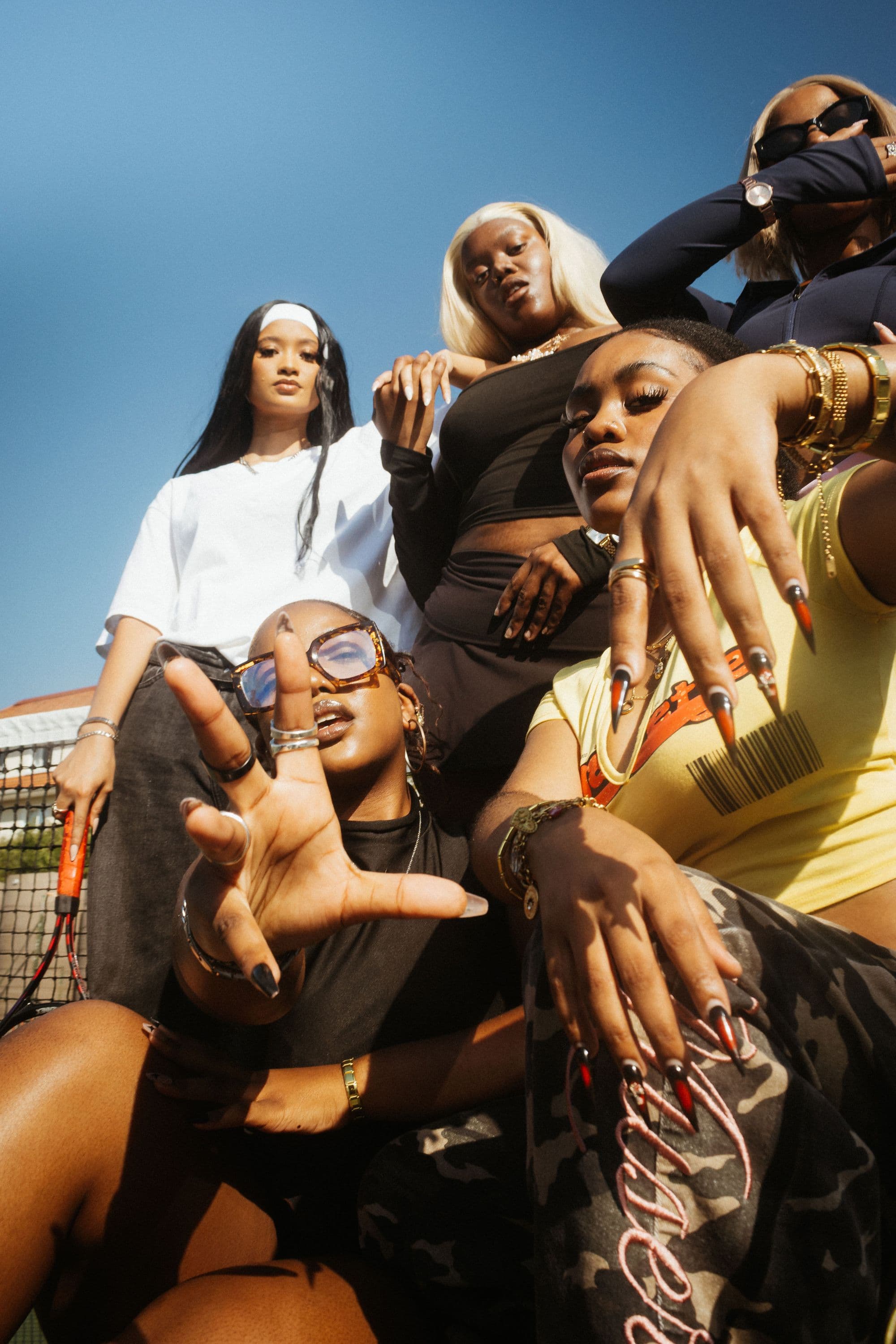 The NEUXJEWELS crew on court, stacked in gold and silver